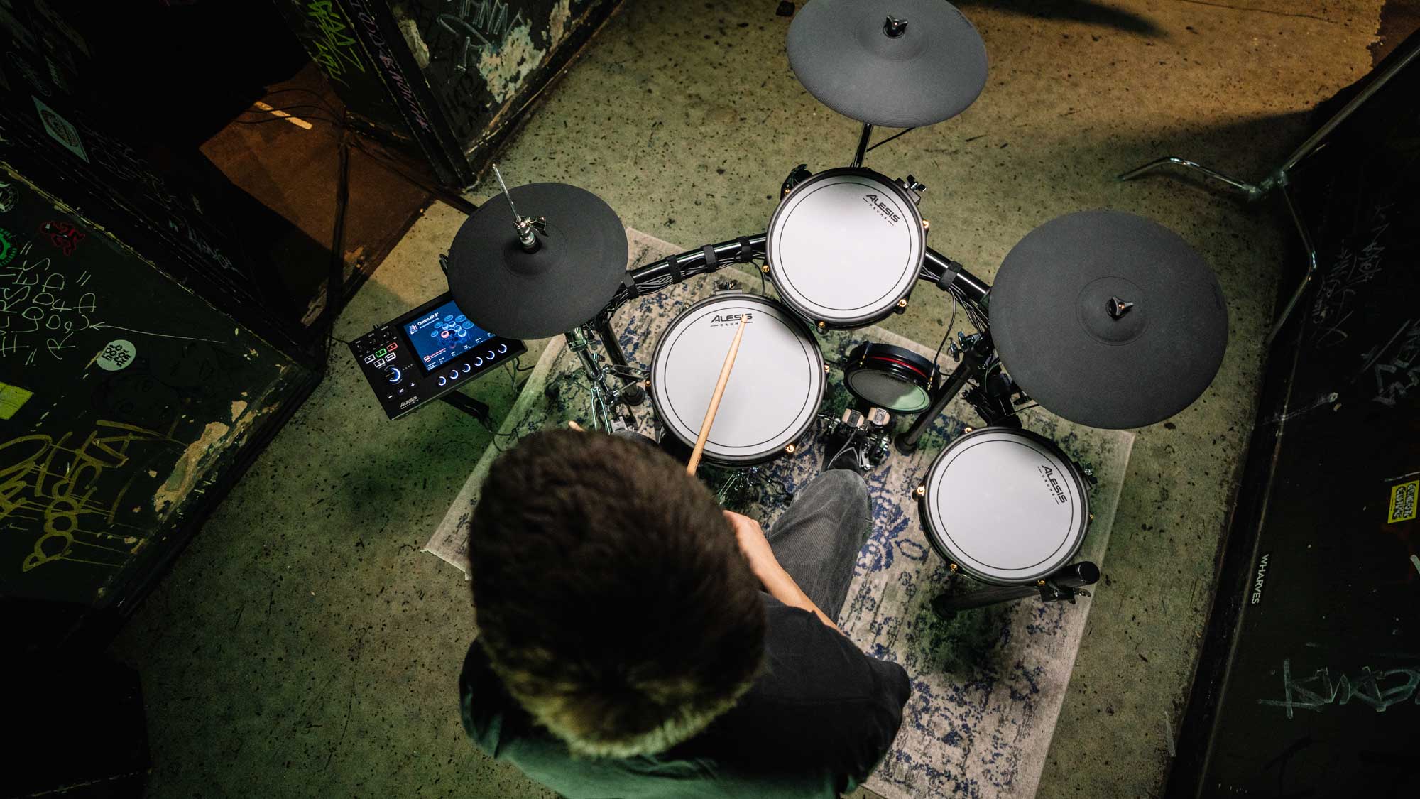 Overhead view of drummer playing Alesis Strata Club kit