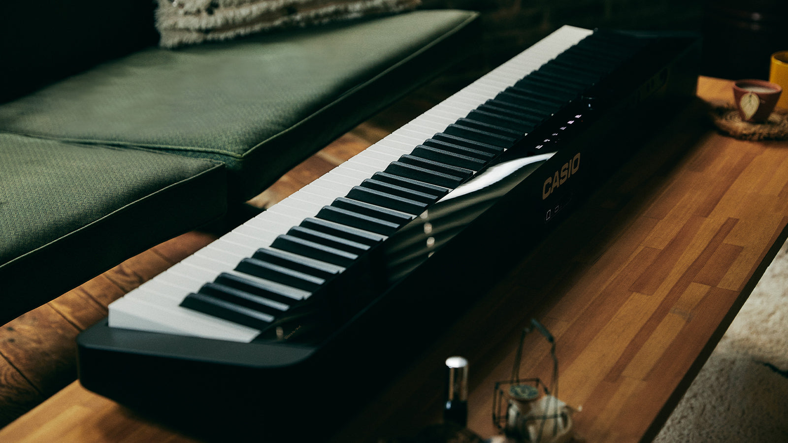 A Casio PX-S1100 on a coffee table