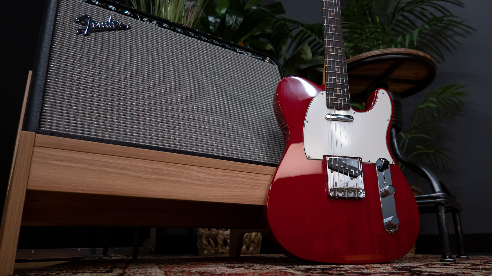 A Fender Telecaster leaning against a Fender amplifier