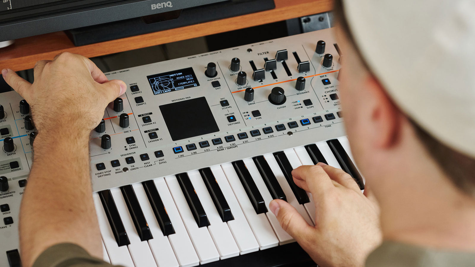 Musician playing Roland Gaia 2 synthesizer