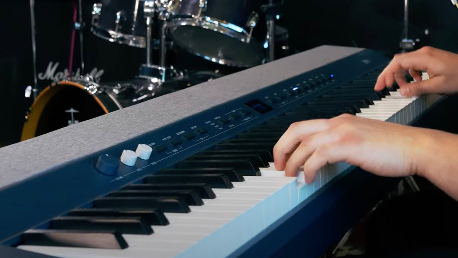 A young man playing a Kurzweil KaP1