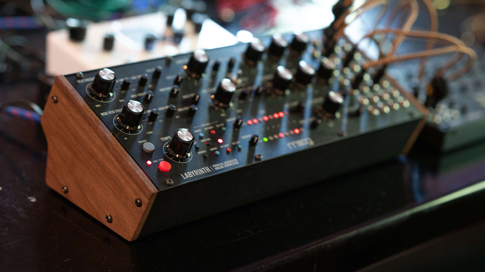 A Moog Labyrinth on a desk in a studio