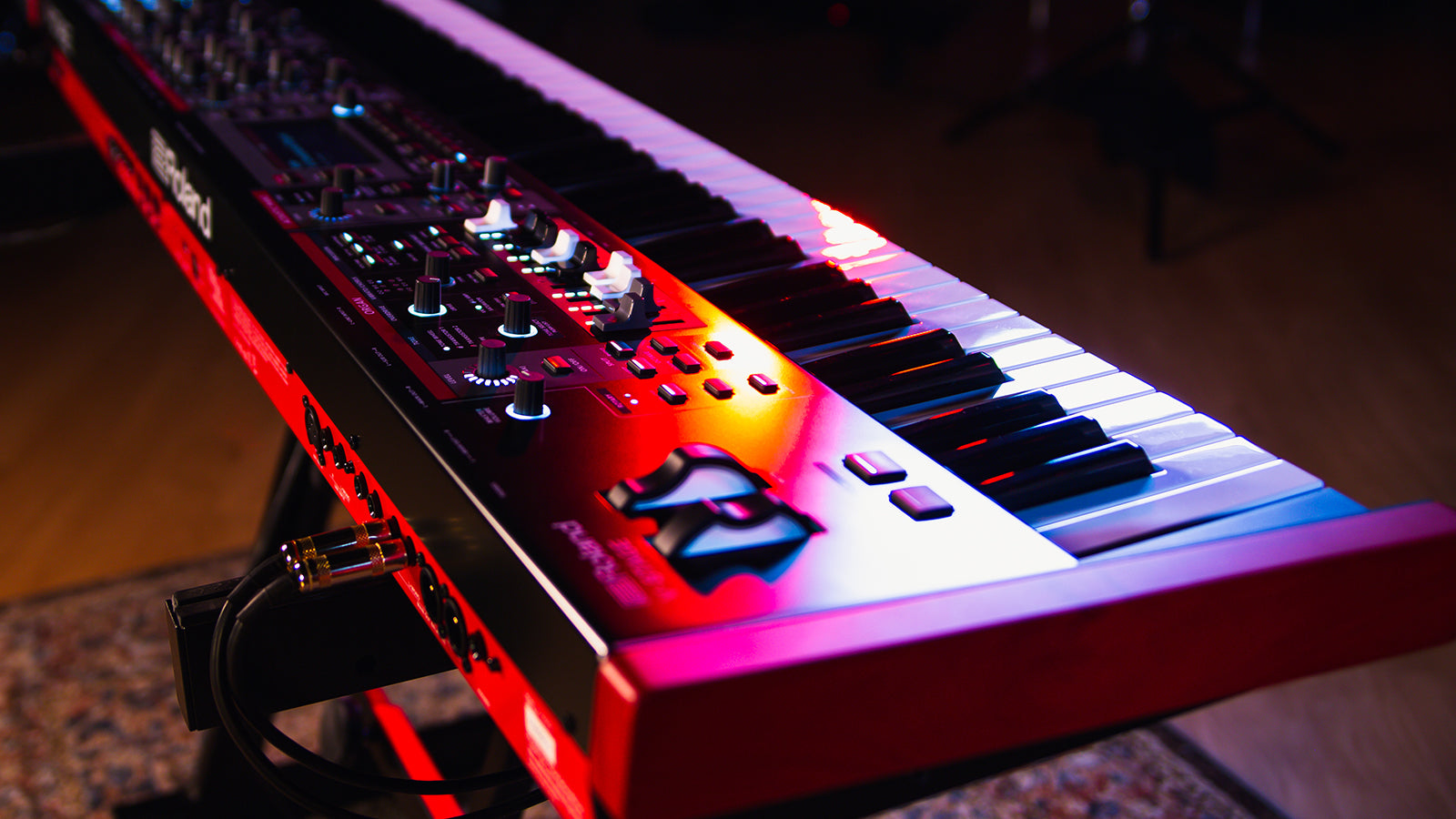 A Roland V-Stage piano on a stand in a studio