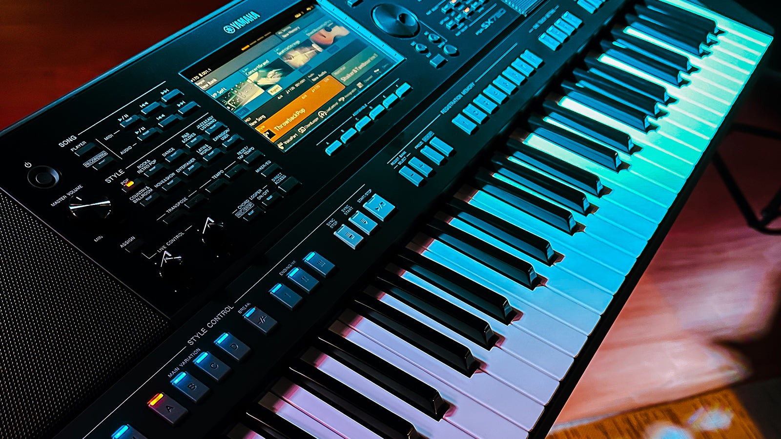 A Yamaha PSR-SX720 on a stand in a studio