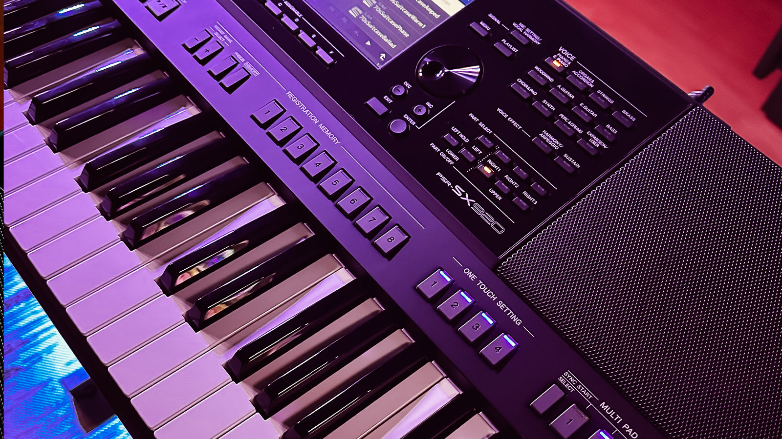 A Yamaha PSR-SX920 on a stand in a studio