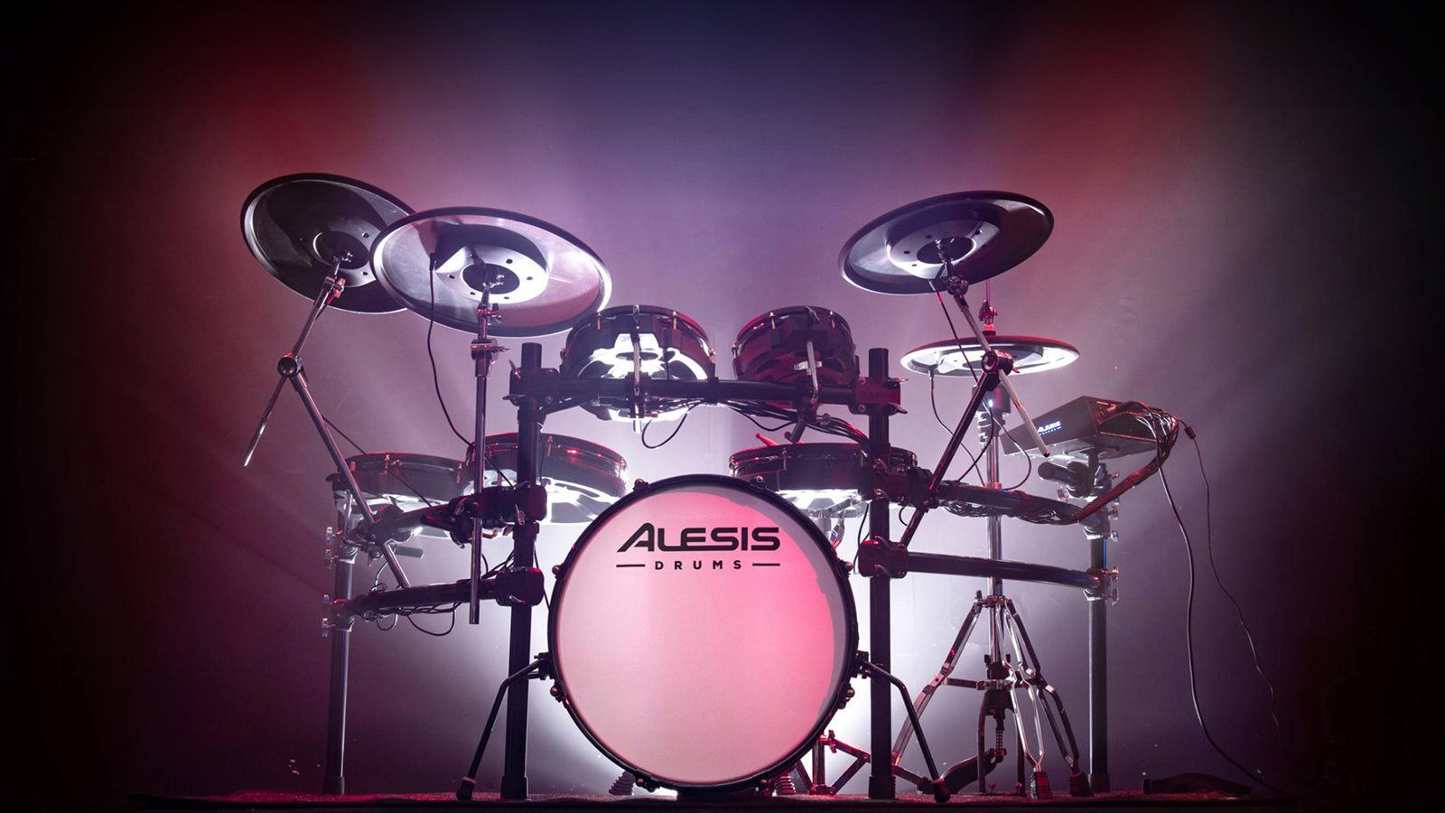 An Alesis Strata Prime lit up on stage