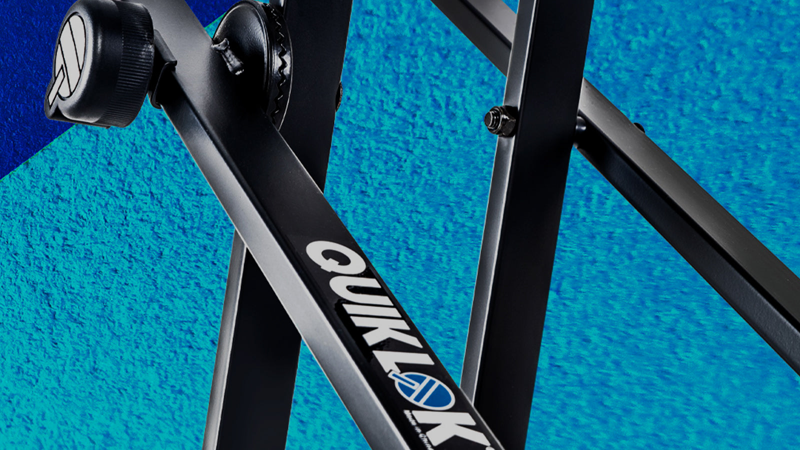 Up-close, cropped image of a QuikLok keyboard stand on a textured background