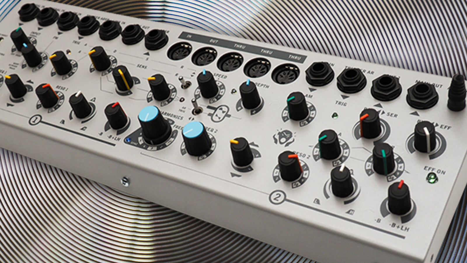 A Sherman modular synth on a spiral metal background
