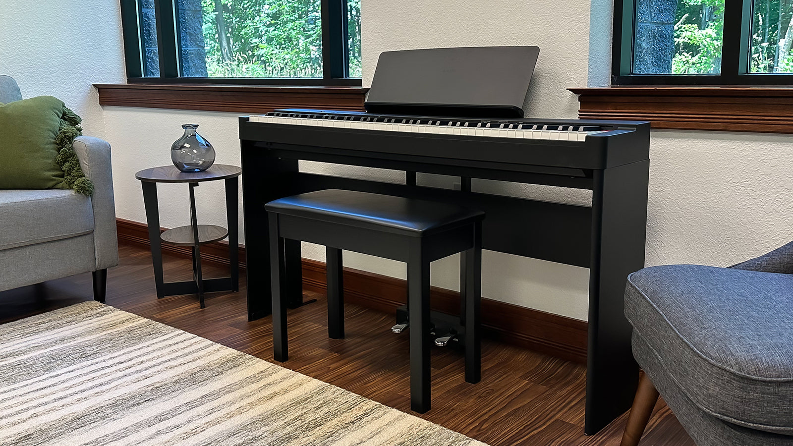A Yamaha P-225 digital piano in a stylish living room