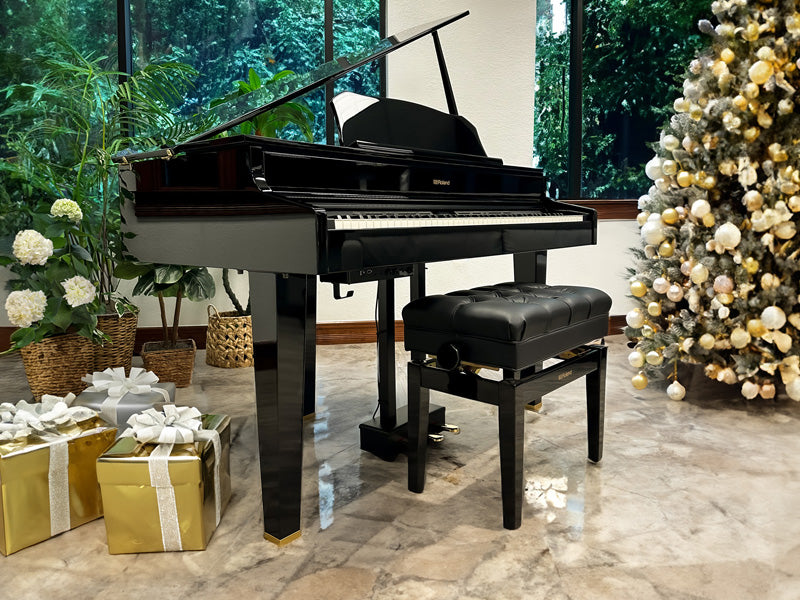 Roland GP607 surrounded by gifts and a Christmas tree