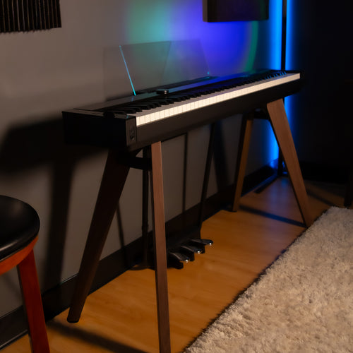 Casio PX-S7000 Digital Piano - Black - side view in a home studio