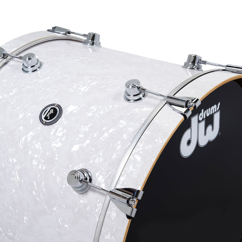 Close-up of a DW (Drum Workshop) drum with white glitter finish and black side.