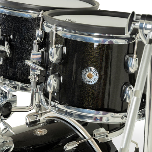 Close-up of Gretsch Catalina EVO Black Sparkle rack toms with chrome hardware and badge
