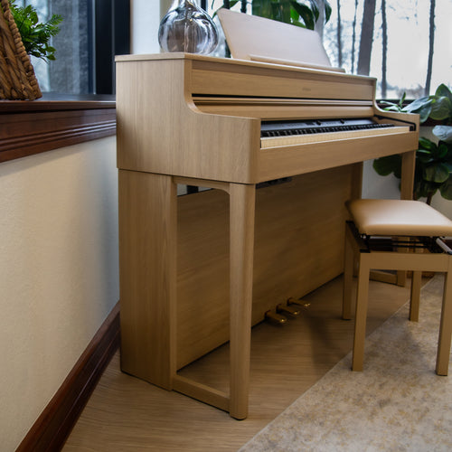 Side view of a Roland HP704 Digital Piano - Light Oak
