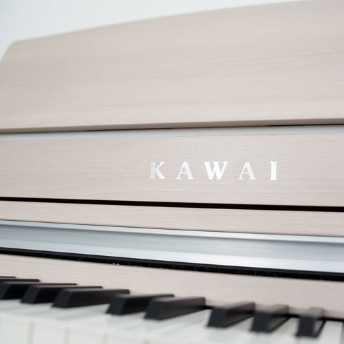 Kawai CA501 Concert Artist Digital Piano - White Maple - Close up of the Kawai logo on the front