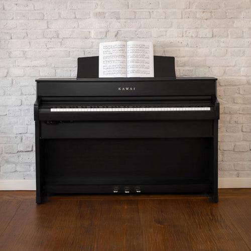 Kawai CA701 Digital Piano - Satin Black - Against brick wall