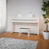 Kawai CA501 Concert Artist Digital Piano - Satin White - Left angle in a living room