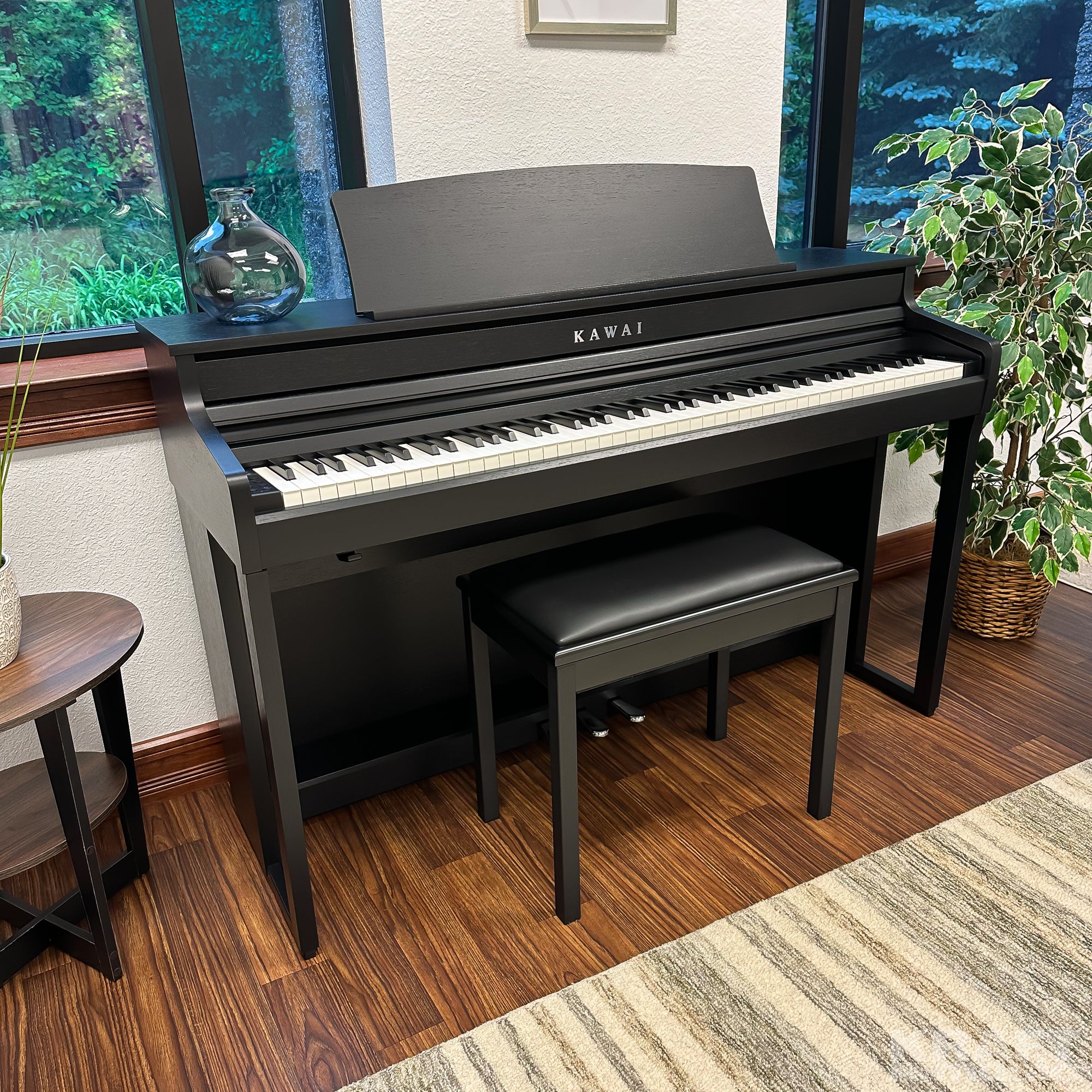 Kawai CA401 Concert Artist Digital Piano - Satin Black - Right angle in a stylish living room