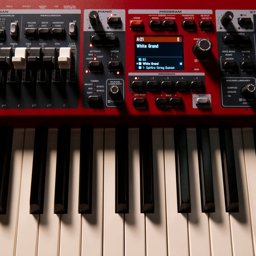 Close-up of a Nord Electro 7 with black and white keys, control knobs, and a small display screen.