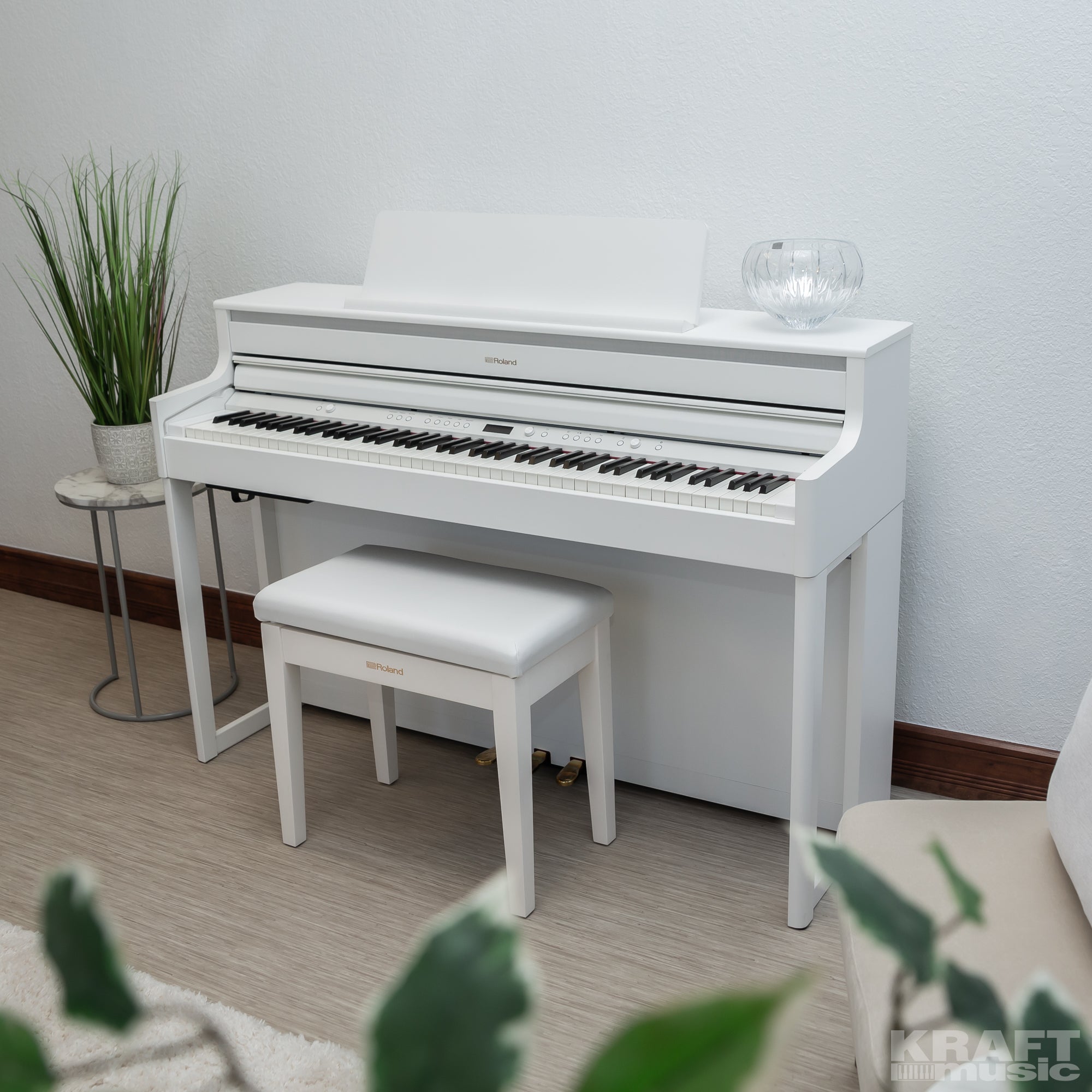 Roland HP704 Digital Piano - Satin White - left facing in stylish living room