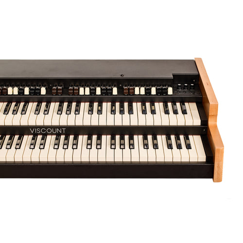 Angled close view of the Viscount Legend 261 from the right, showing the drawbars, percussion controls, and the stacked upper and lower keyboards