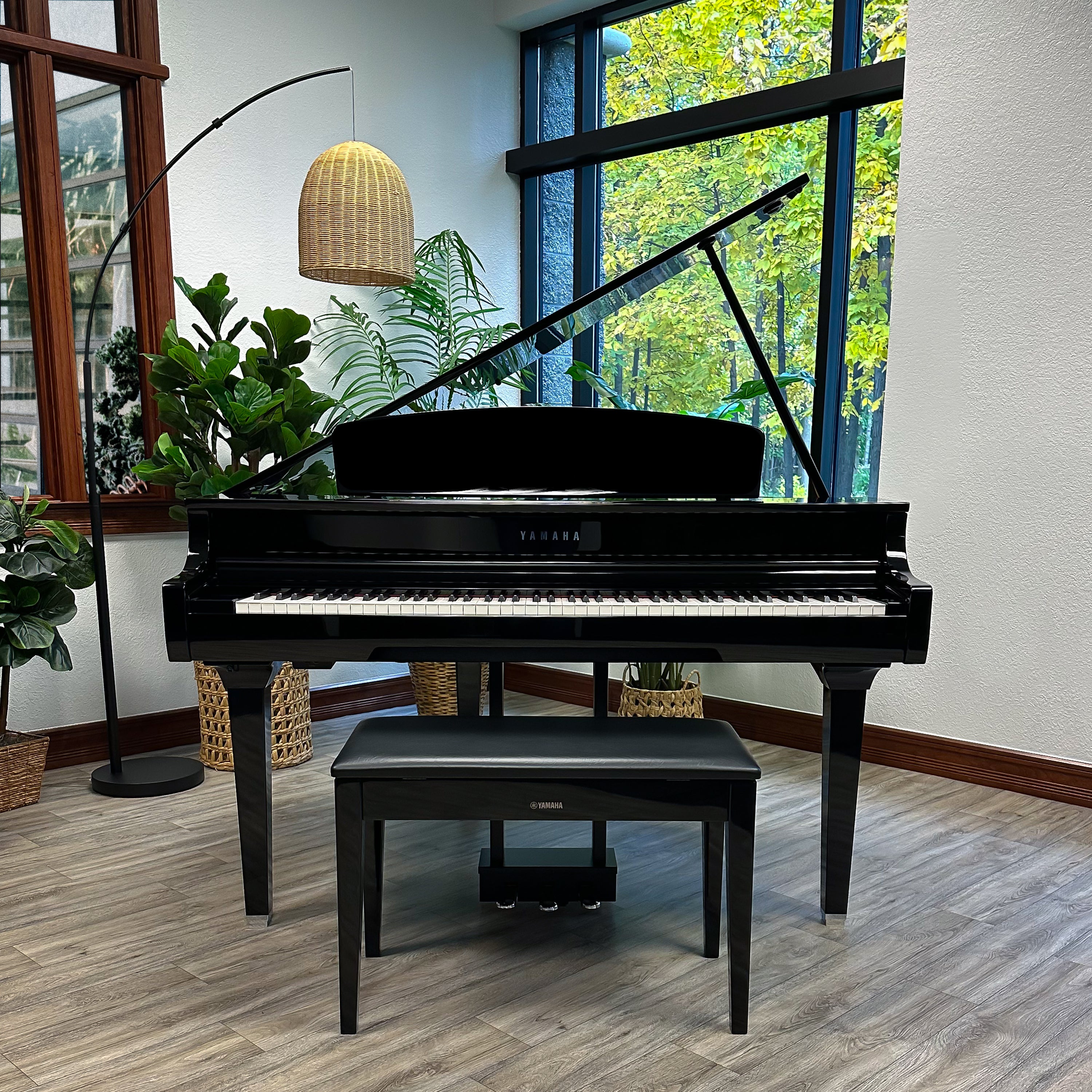 Yamaha Clavinova CLP-795GP Digital Piano - Polished Ebony - front view in a stylish living room