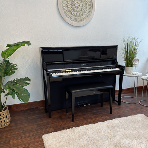 Yamaha Clavinova CSP-295 Digital Piano - Polished Ebony - in a stylish living room facing right