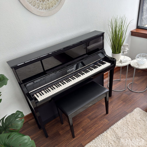 Yamaha Clavinova CSP-295 Digital Piano - Polished Ebony - in a stylish living room from above