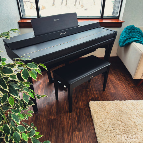 Yamaha Clavinova CVP-909 Digital Piano - Matte Black - in a stylish living room with key cover closed