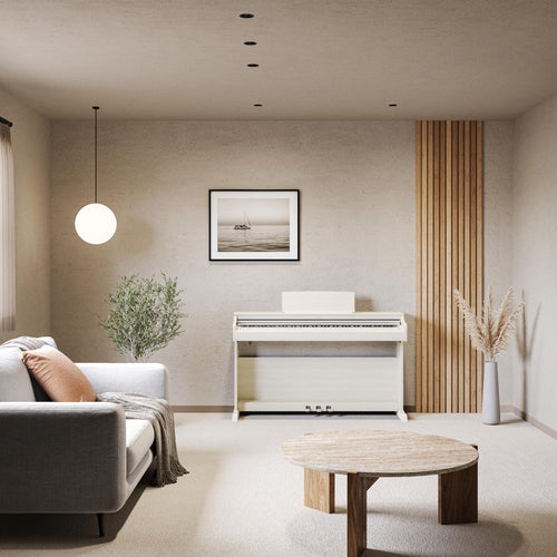 Modern living room with a white piano, sofa, and decorative elements.
