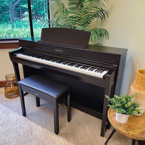 Yamaha Clavinova CLP-745 Digital Piano - Rosewood - left facing in a stylish room