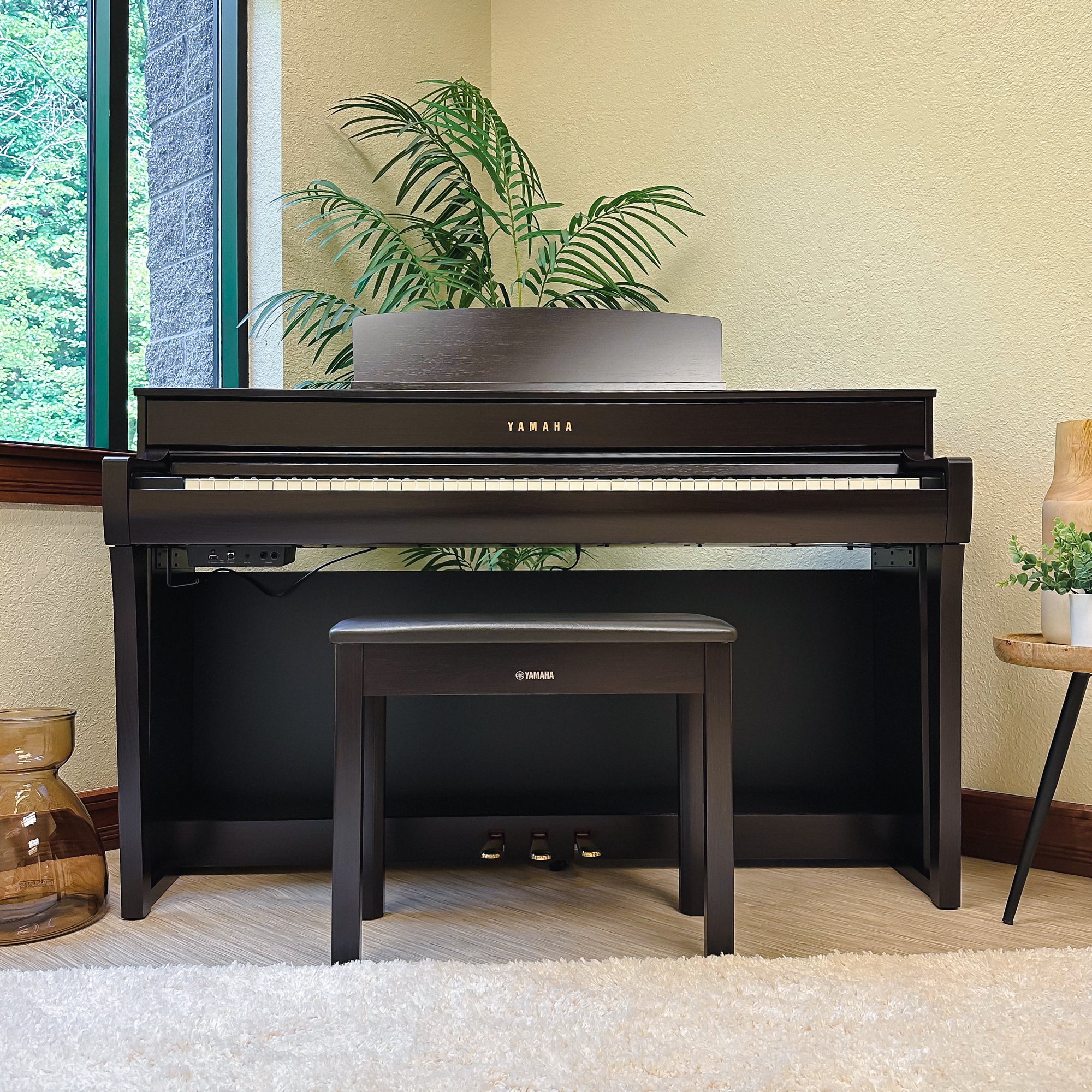 Yamaha Clavinova CLP-745 Digital Piano - Rosewood - front view from straight on in a stylish room
