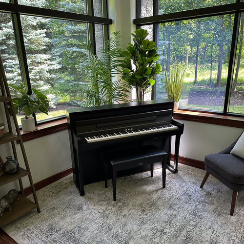 Yamaha Clavinova CLP-885 Digital Piano - Matte Black in a stylish room, view 7