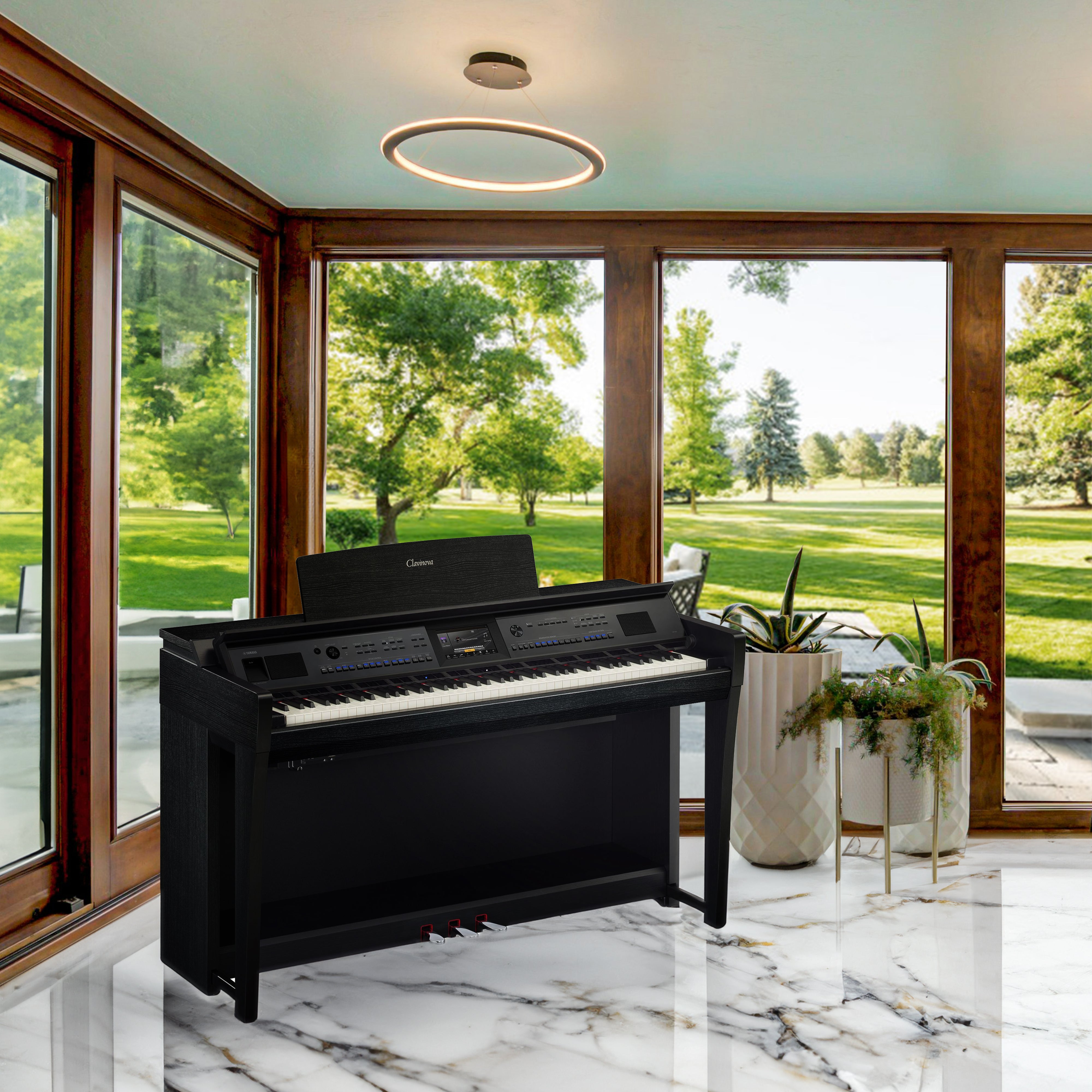 Yamaha Clavinova CVP-905 Digital Piano - Matte Black - in a stylish room overlooking a golf course