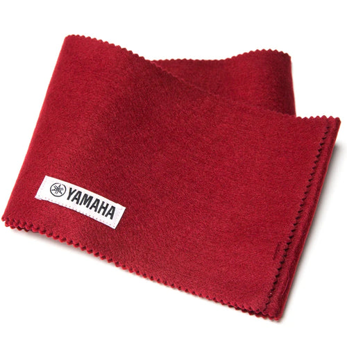 Folded red Yamaha felt key cover with pinked edges and a sewn-in white Yamaha logo tag, on a white background.