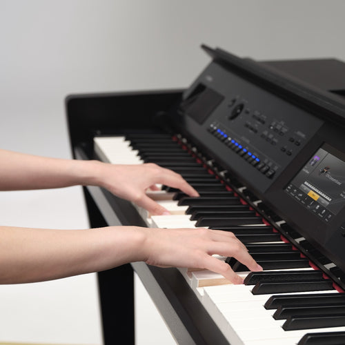 Yamaha Clavinova CVP-905 Digital Piano - Matte Black - A young lady playing piano
