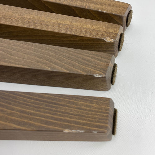 shows minor damage to the bench. Small chips on inner edge of legs