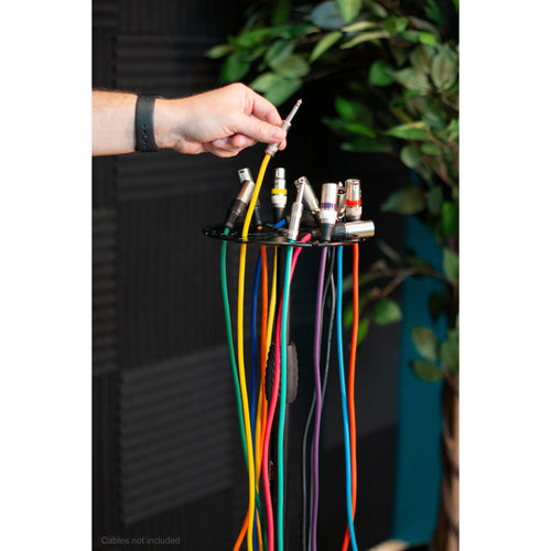 Cable Hanger tray on it's stand filled with cables and someone hanging on cable to the tray