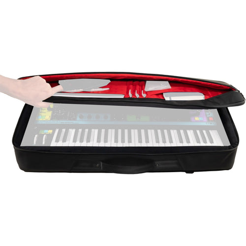 Perspective view of partially open Moog Matriarch SR Case with top zippered pocket open and ghosted images of Matriarch synthesizer and accessories for reference
