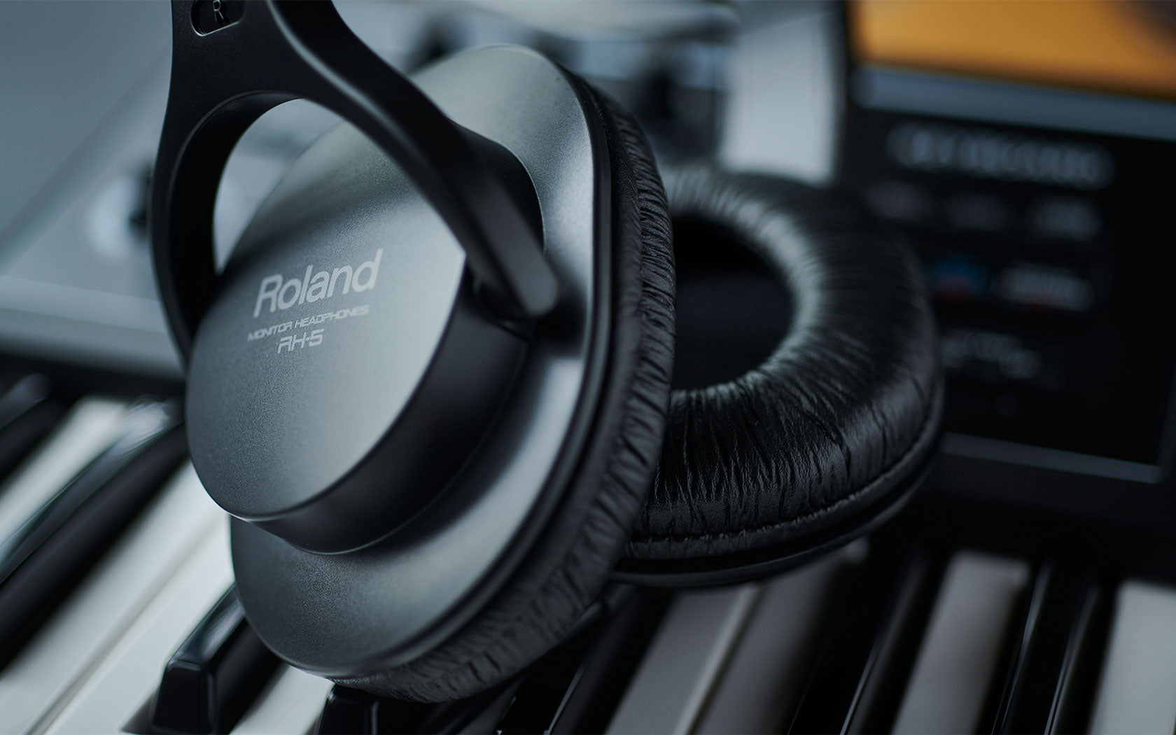 Lifestyle image of the Roland RH-5 Stereo Headphones - Black, focusing on the ear cups