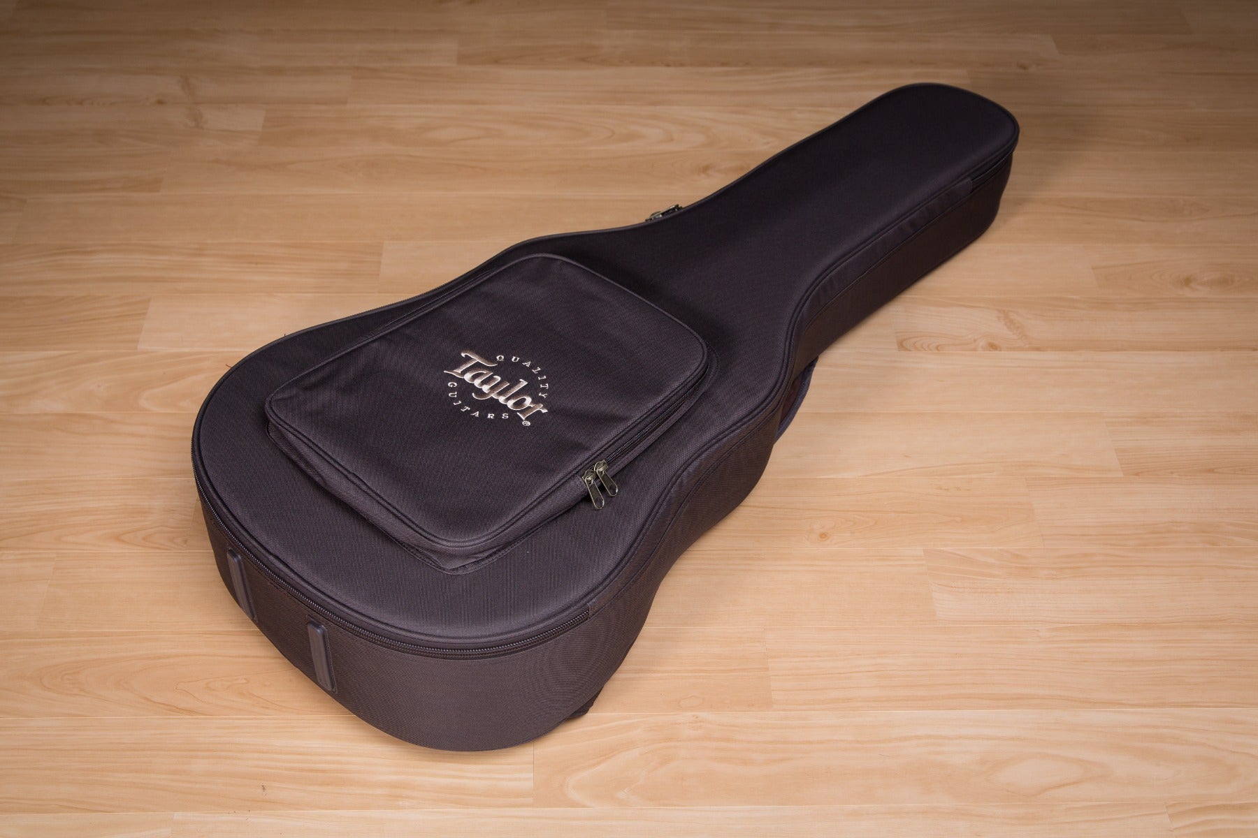 Included guitar case for the Taylor AD27e Flame Top Acoustic-Electric Guitar - Woodsmoke view 1