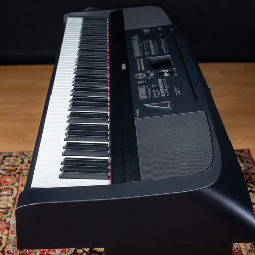 Side view of the Yamaha DGX-670 on a stylish rug