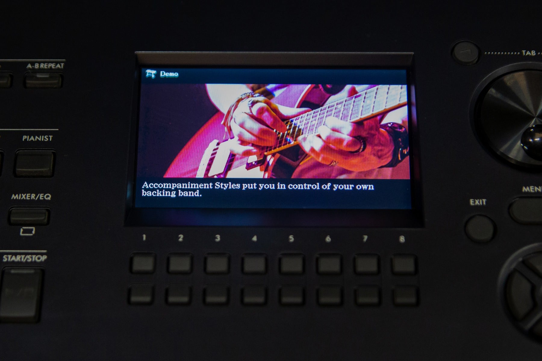 Close up of the Yamaha DGX-670 control panel showing the accompaniment styles option on the screen