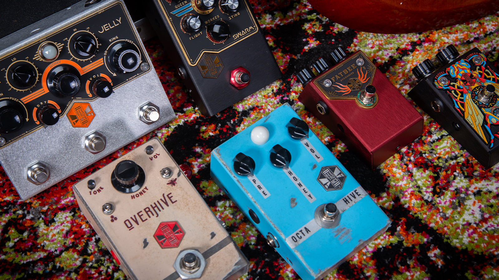 A collection of Beetronics pedals on a stylish rug