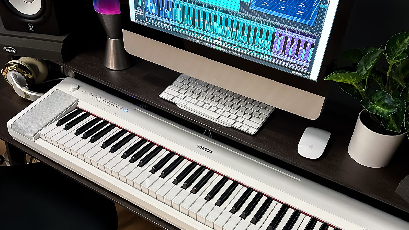 A Yamaha Piaggero NP-15 on a desk in a home studio