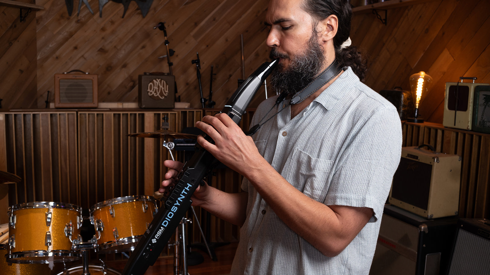 A young man playing an ASM Diosynth