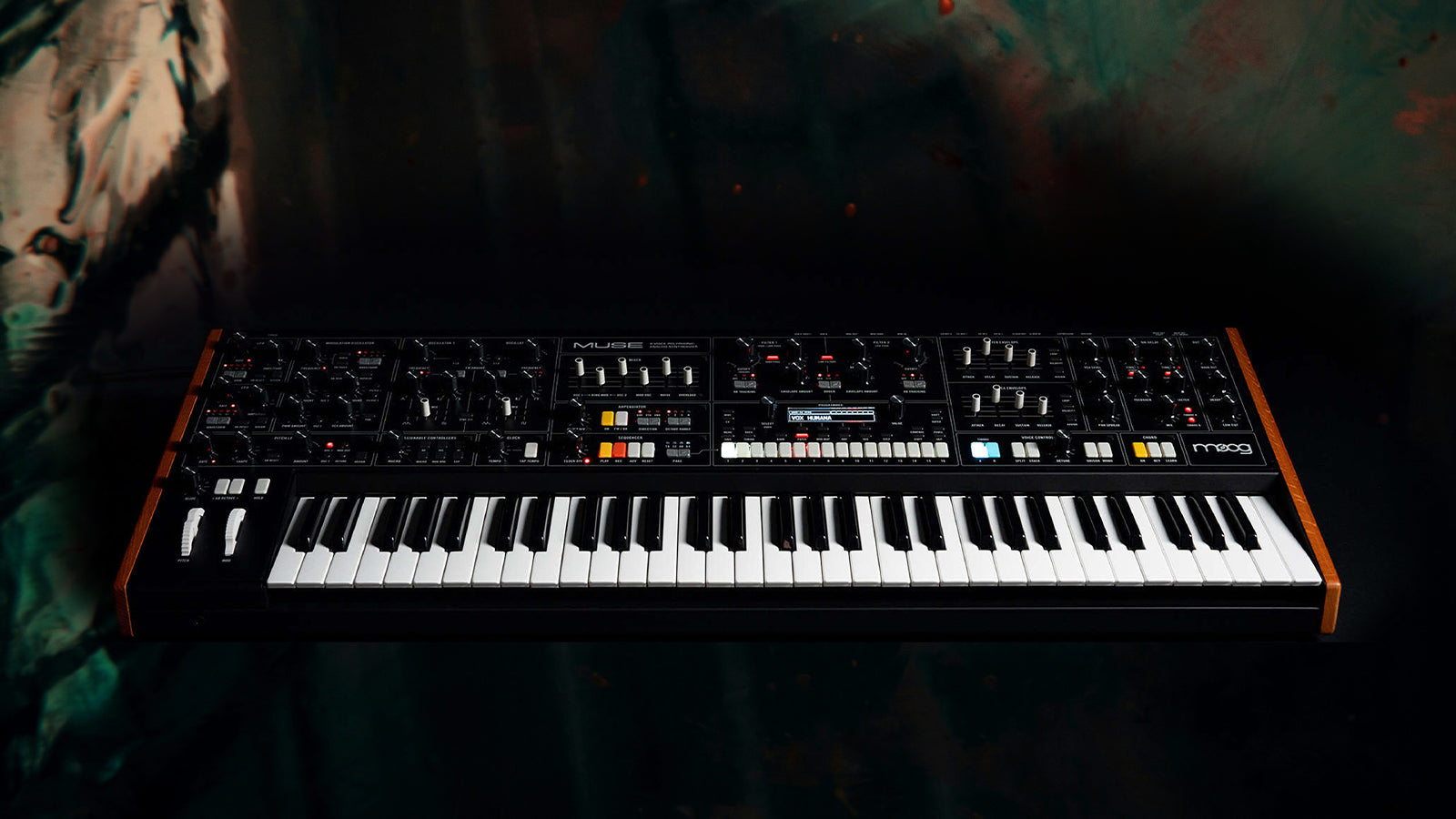 A Moog Muse on a dark street background