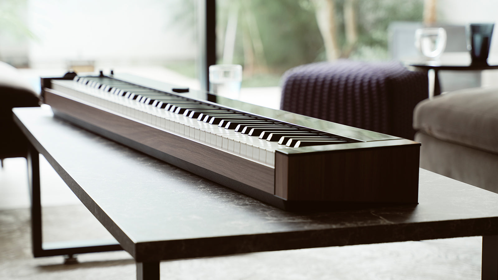A Casio portable piano on a coffee table