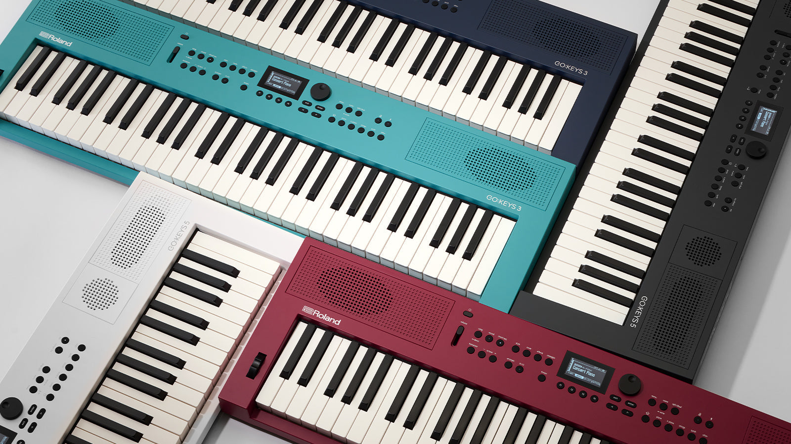 Go:Keys 3 & Go:Keys 5 keyboards in various colors arranged in a geometric pattern