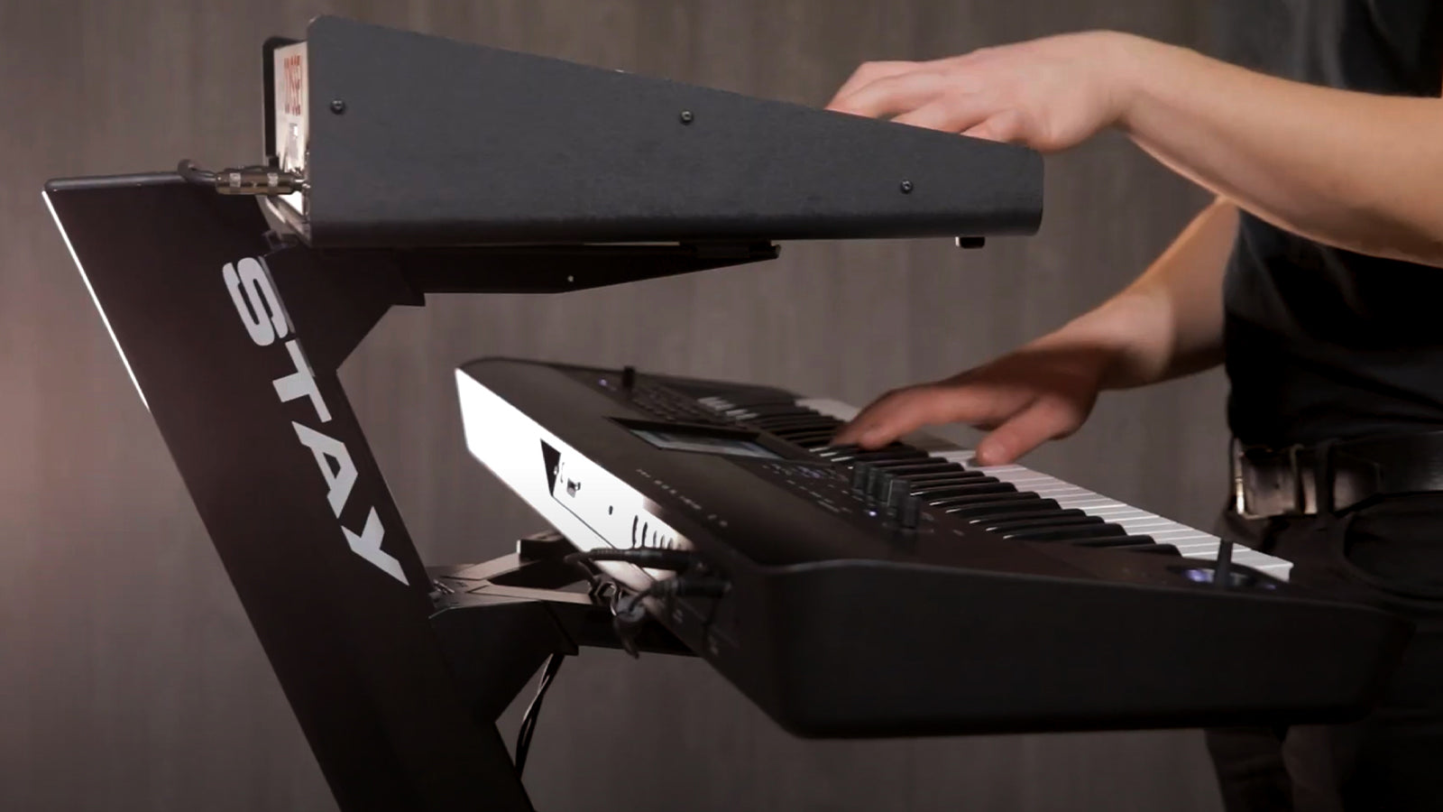 A Stay stand with keyboards on it